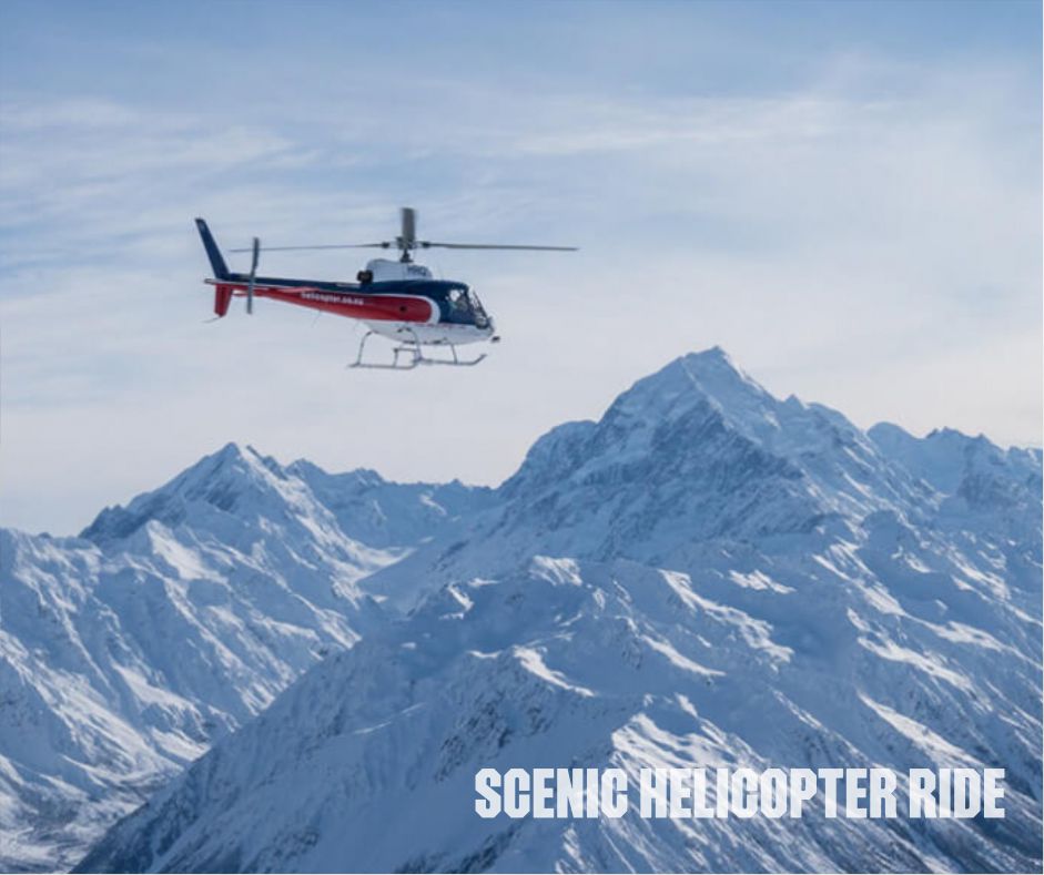 Scenic helicopter tour over stunning New Zealand landscape, showcasing breathtaking views of mountains, lakes, and lush greenery, New Zealand group tour from Indore